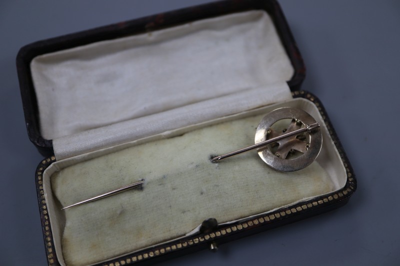 An early 20th century yellow metal and Scottish hardstone set stick pin, 78mm, gross 4.4 grams.